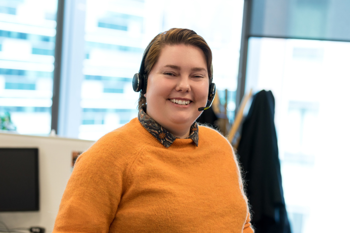 Photo of a Customer Solutions team member smiling. 