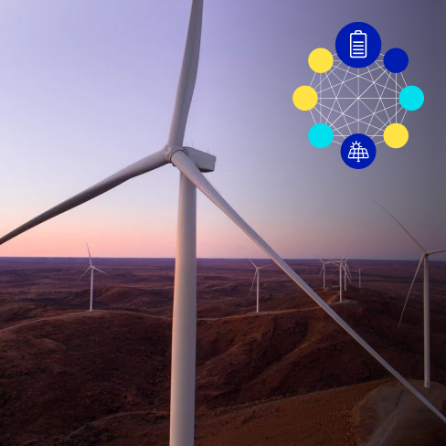 Close up of white wind turbines in a field at dusk with corner imagery