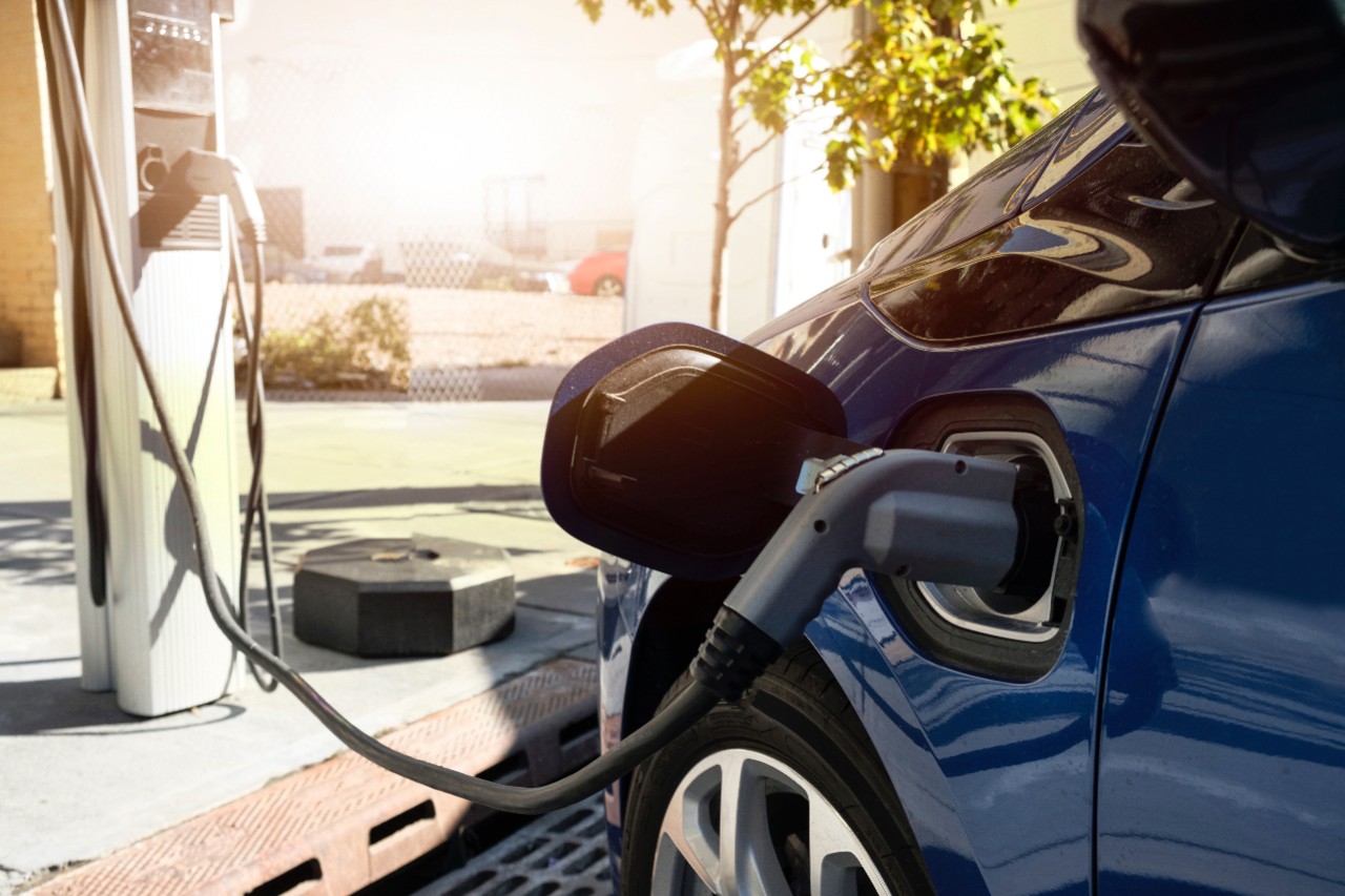 Blue EV charging at public charging station